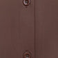 Woman wearing long sleeve button front bodysuit slim fit outfit