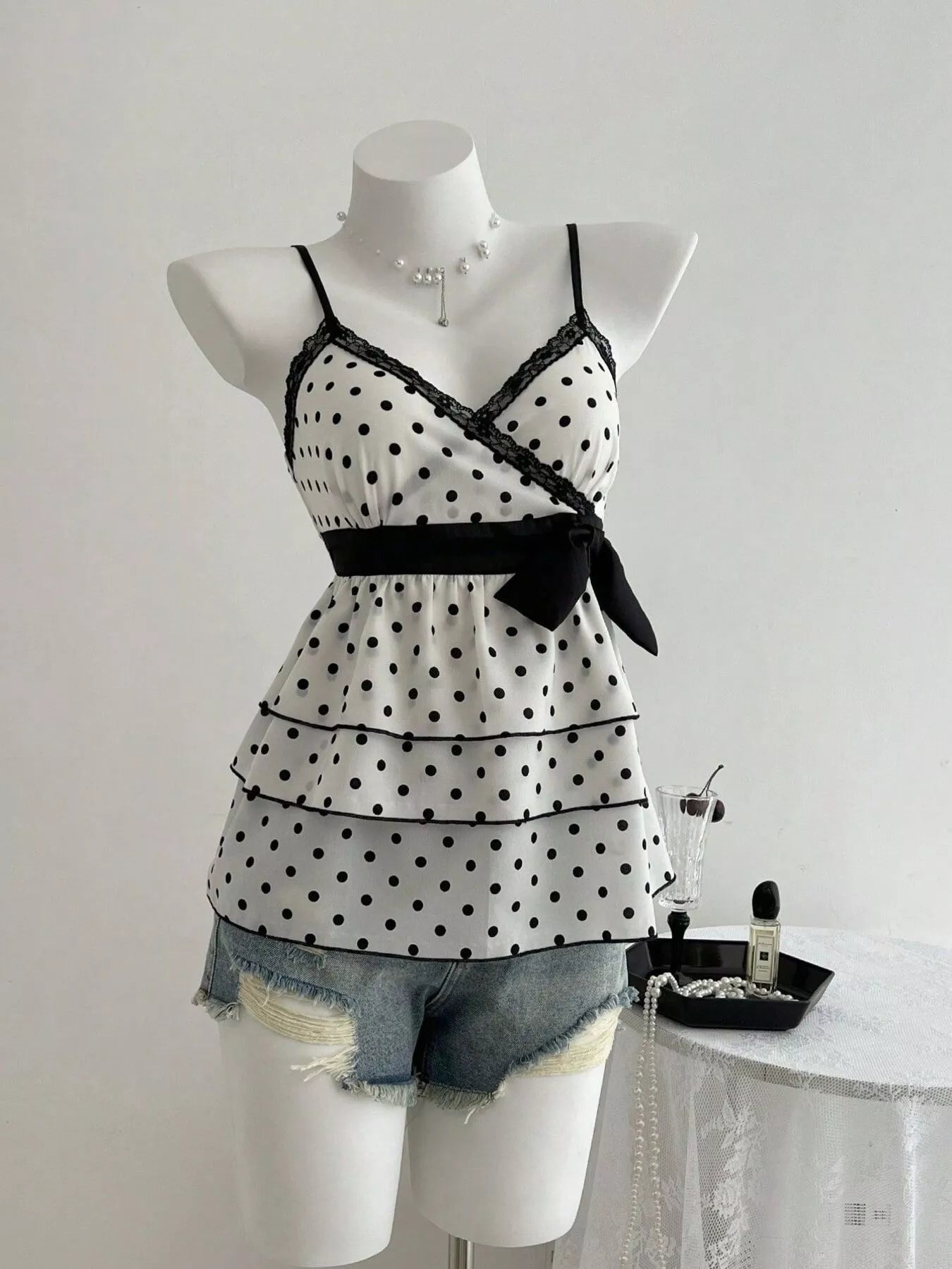 Polka dot ruffle hem cami with lace trim for women Elluxora